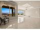 A sun-filled living room with large windows and tile flooring at 1348 Basin Vw, Mesquite, NV 89034