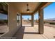 Covered outdoor patio with a ceiling fan and views of the desert landscape at 1348 Basin Vw, Mesquite, NV 89034