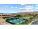 Aerial view of community pickleball courts surrounded by desert landscape and mountains at 1348 Basin Vw, Mesquite, NV 89034