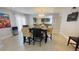 Dining room featuring tile floors, modern furniture, and view into the kitchen at 1740 Capistrano Ave, Las Vegas, NV 89169