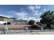 Charming two-story home featuring a desert landscape and palm tree at 1740 Capistrano Ave, Las Vegas, NV 89169