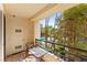 Private balcony features outdoor seating and serene views of the pool and community at 220 E Flamingo Rd # 111, Las Vegas, NV 89169