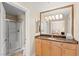 Bright bathroom with granite vanity, shower, and view to the bedroom at 220 E Flamingo Rd # 111, Las Vegas, NV 89169
