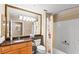 A full bathroom featuring a granite vanity with a large mirror and a shower-tub combo at 220 E Flamingo Rd # 111, Las Vegas, NV 89169