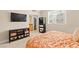 Comfortable bedroom features natural light, neutral tones, and a view to the bathroom at 220 E Flamingo Rd # 111, Las Vegas, NV 89169