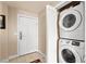 Convenient in-unit laundry closet with stacked washer and dryer set at 220 E Flamingo Rd # 111, Las Vegas, NV 89169