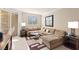 Comfortable living room featuring a plush sectional sofa, contemporary rug, and stylish decor at 220 E Flamingo Rd # 111, Las Vegas, NV 89169
