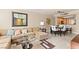 Open-concept living space with a comfortable sectional sofa, dining area, and kitchen at 220 E Flamingo Rd # 111, Las Vegas, NV 89169