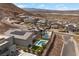 Aerial view of properties showcasing the community, swimming pools, and desert landscape at 298 Watteau Ct, Henderson, NV 89012