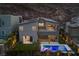 Stunning backyard featuring a refreshing pool, lush lawn, covered patio, and mountain views at 298 Watteau Ct, Henderson, NV 89012