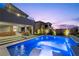 A stunning backyard with a pool, covered patio, and landscaped garden, perfect for outdoor living and relaxation at 298 Watteau Ct, Henderson, NV 89012