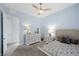 Bedroom with a modern bed, ceiling fan, and carpet floors at 298 Watteau Ct, Henderson, NV 89012
