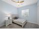 This bedroom offers neutral decor, light blue walls, and carpeted floors for a comfortable and stylish space at 298 Watteau Ct, Henderson, NV 89012