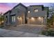Modern home with a three-car garage, neutral tones, and inviting curb appeal at 298 Watteau Ct, Henderson, NV 89012