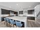 Spacious kitchen with large island, stainless steel appliances, and sleek dark cabinetry at 298 Watteau Ct, Henderson, NV 89012