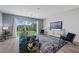 Comfortable living room with stylish furnishings, providing a relaxing space with backyard views through sliding glass doors at 298 Watteau Ct, Henderson, NV 89012