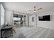 Bright main bedroom with a king bed, private balcony access, and sleek decor at 298 Watteau Ct, Henderson, NV 89012