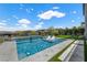 Sparkling swimming pool with sun loungers and lush landscaping, perfect for relaxation at 298 Watteau Ct, Henderson, NV 89012