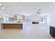 Open-concept kitchen boasts a large island, modern appliances, and ample counter space at 3156 Shadowridge Ave, Las Vegas, NV 89120
