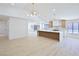 Spacious living room flows into the kitchen, offering an open layout perfect for modern living at 3156 Shadowridge Ave, Las Vegas, NV 89120
