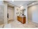 Primary bathroom featuring double sinks with granite countertops and a beautifully tiled walk-in shower at 3360 Lochside Dr, Henderson, NV 89044