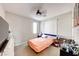 This bedroom features a ceiling fan, neutral paint, carpet, and a large window at 3360 Lochside Dr, Henderson, NV 89044