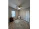 Bright bedroom featuring a ceiling fan, carpeted floors and two windows providing plenty of natural light at 3360 Lochside Dr, Henderson, NV 89044