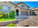 Charming two-story home with a three-car garage and beautifully landscaped front yard at 3360 Lochside Dr, Henderson, NV 89044