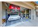 Spacious garage featuring a car lift for multiple vehicles and ample storage at 3360 Lochside Dr, Henderson, NV 89044