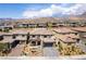 Breathtaking aerial view of a residential area surrounded by desert landscaping, showcasing the community's mountain views at 395 Prairie Sun St, Las Vegas, NV 89138