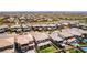 An aerial view showcases a well-planned community with modern homes, swimming pools, and landscaped yards, all under a bright sky at 395 Prairie Sun St, Las Vegas, NV 89138