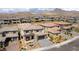 Beautiful aerial view showcasing lush landscaping and mountain views, making this community a serene and attractive neighborhood at 395 Prairie Sun St, Las Vegas, NV 89138