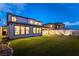 Spacious backyard featuring low-maintenance artificial turf, creating a private and inviting outdoor living space at 395 Prairie Sun St, Las Vegas, NV 89138
