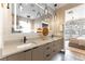 Luxurious bathroom boasting double sinks, contemporary lighting, and a view to the Primary bedroom at 395 Prairie Sun St, Las Vegas, NV 89138