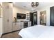 Well-appointed bedroom includes storage, built-in shelving, and a mini-fridge for comfort and convenience at 395 Prairie Sun St, Las Vegas, NV 89138