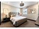 Serene bedroom featuring a plush bed, stylish lamps, and natural light from the window at 395 Prairie Sun St, Las Vegas, NV 89138