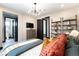 Comfortable bedroom boasts a TV, shelving, and an ensuite bathroom for added convenience at 395 Prairie Sun St, Las Vegas, NV 89138