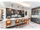Beautiful kitchen with a large island, pendant lighting, and modern appliances at 395 Prairie Sun St, Las Vegas, NV 89138