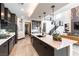 Bright, open kitchen layout featuring modern appliances, a large island, and sleek cabinetry at 395 Prairie Sun St, Las Vegas, NV 89138