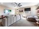 Cozy living room features a large TV, comfortable seating, and a ceiling fan for added comfort at 395 Prairie Sun St, Las Vegas, NV 89138