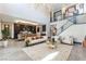 Open-concept living space with modern furnishings adjacent to the well-appointed kitchen at 395 Prairie Sun St, Las Vegas, NV 89138
