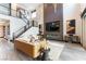 Bright living room featuring soaring ceilings, modern fireplace, and contemporary decor at 395 Prairie Sun St, Las Vegas, NV 89138