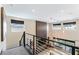 Bright living room showcases modern railing, neutral tones, and an eye-catching contemporary light fixture at 395 Prairie Sun St, Las Vegas, NV 89138