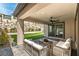 Cozy covered patio perfect for outdoor living with seating and access to the landscaped yard at 395 Prairie Sun St, Las Vegas, NV 89138