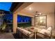 Inviting outdoor patio with comfortable seating and a view of the landscaped backyard at 395 Prairie Sun St, Las Vegas, NV 89138