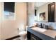 Chic powder room with a modern vanity, stylish mirror, and elegant fixtures at 395 Prairie Sun St, Las Vegas, NV 89138