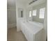 Bathroom with sink, white countertops, a large mirror, and a combined shower and tub at 520 Shire Hall St, Las Vegas, NV 89178