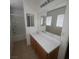 Clean bathroom with dual sink, white countertop, and a combined shower and tub at 520 Shire Hall St, Las Vegas, NV 89178
