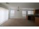 Bright, expansive living room with neutral carpeting, providing ample space and natural light at 520 Shire Hall St, Las Vegas, NV 89178