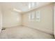 Finished garage with bright natural light from plantation shutter windows and plush carpet at 8318 Sonora Del Sol St, Las Vegas, NV 89113